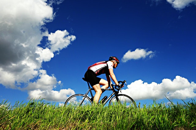 A man cycling in the field